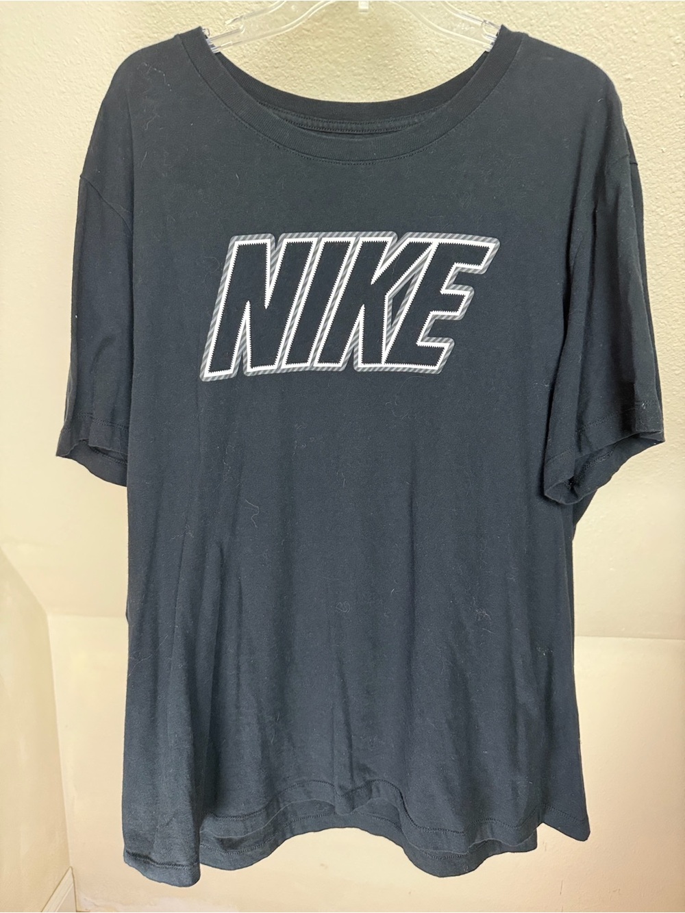 Nike Black Tee with Contrasting White-Outlined Logo